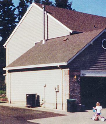 Exterior side before remodeling work began to add second story.