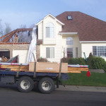 Photo of the exterior of the houes with the attic above the garage removed