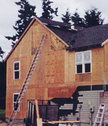 Side exterior during construction.