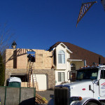 Photo of the exterior house as the second story addition is being built.