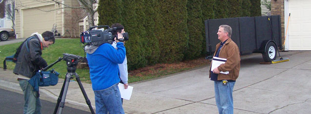 Photo of John Sramek being filmed for New Spaces TV show in front of second story addition project in Sherwood Oregoni