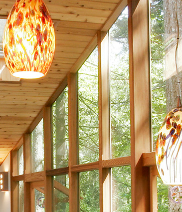 Close up of modern, glass chandeliers in pool room