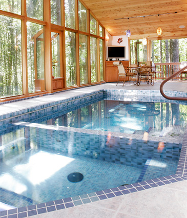 Tiled hot tub and pool in cedar pool room addition